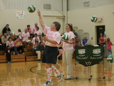 Coach warm-up on Dig Pink night.