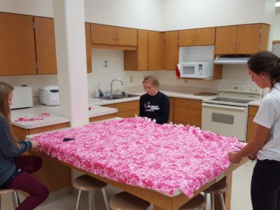 Freshman players worked on a blanket for the baskets this year.